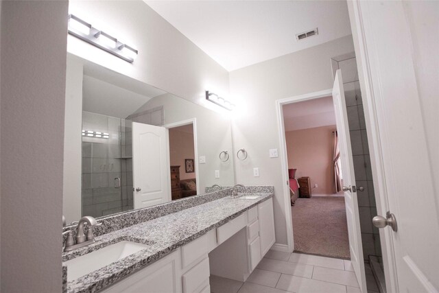 908 Reveille Rd, Fort Worth, TX 76108 - ensuite bathroom with double vanity, a shower stall, tile patterned floors, and baseboards