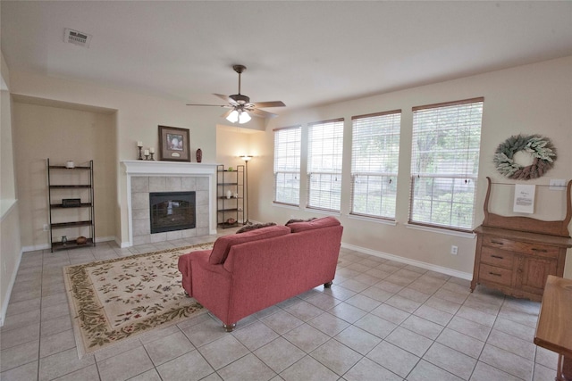 908 Reveille Rd, Fort Worth, TX 76108 - living area featuring ceiling fan, light tile patterned flooring, healthy amount of natural light, and a tile fireplace