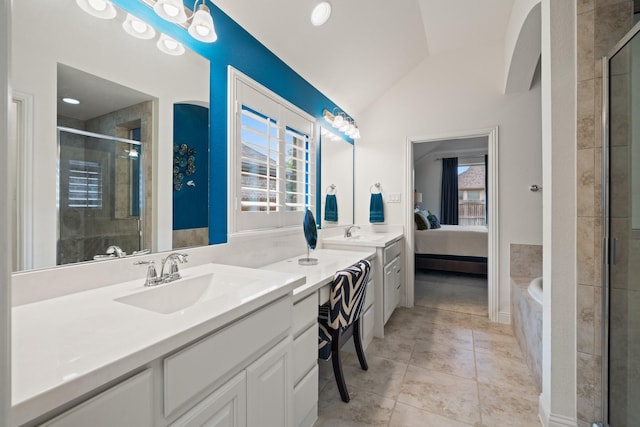 1109 Hot Springs Way, Celina, TX 75009 - bathroom featuring double vanity, lofted ceiling, a stall shower, a bath, and connected bathroom