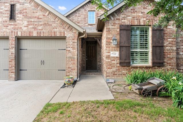 1109 Hot Springs Way, Celina, TX 75009 - view of exterior entry featuring brick siding, an attached garage, and concrete driveway
