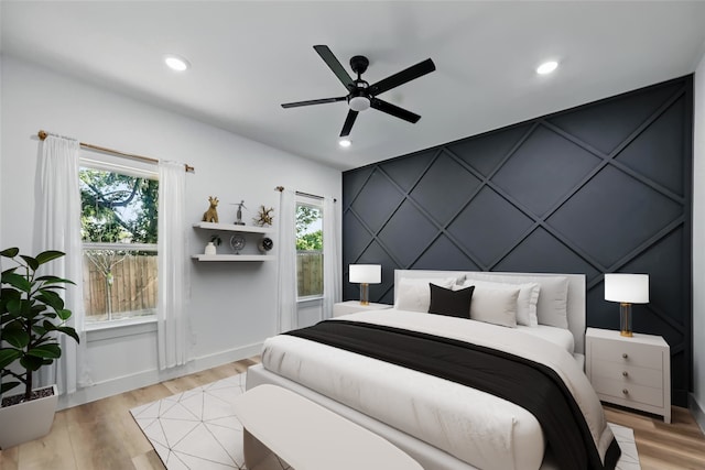 2927 Valentine St, Dallas, TX 75215 - bedroom with a decorative wall, light wood-style floors, an accent wall, recessed lighting, and ceiling fan