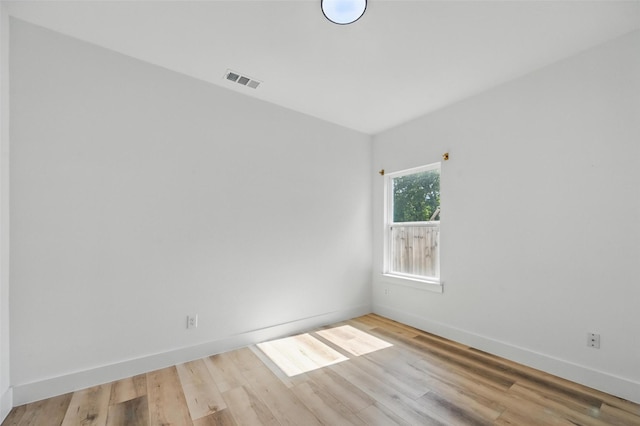 2927 Valentine St, Dallas, TX 75215 - spare room featuring wood finished floors and baseboards
