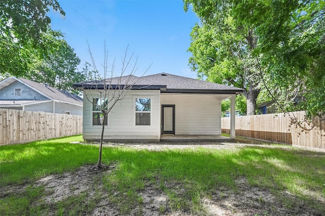 2927 Valentine St, Dallas, TX 75215 - back of property with a patio area and a shingled roof