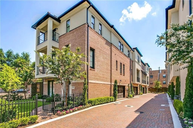 3660 Belvedere Ct, Dallas, TX 75219 - view of building exterior with fence and a residential view