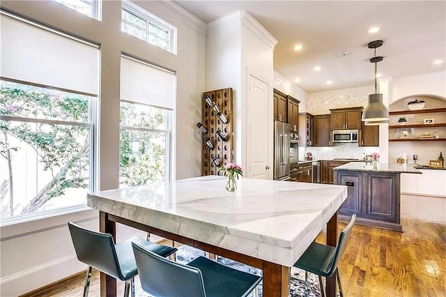 3660 Belvedere Ct, Dallas, TX 75219 - dining space with wood finished floors and ornamental molding