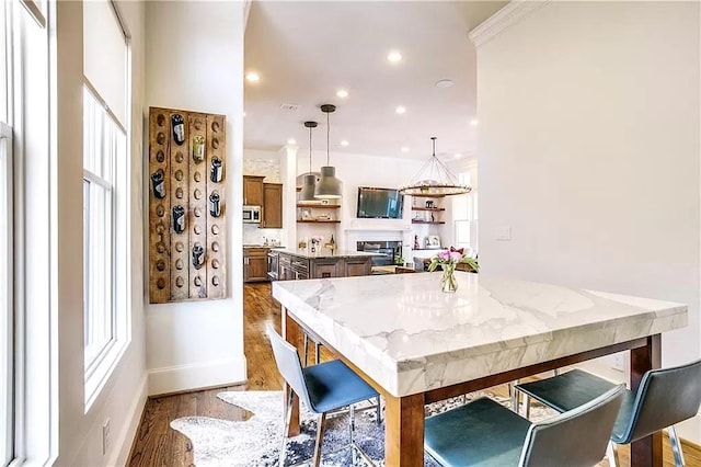 3660 Belvedere Ct, Dallas, TX 75219 - dining space with wood finished floors, recessed lighting, a fireplace, and baseboards