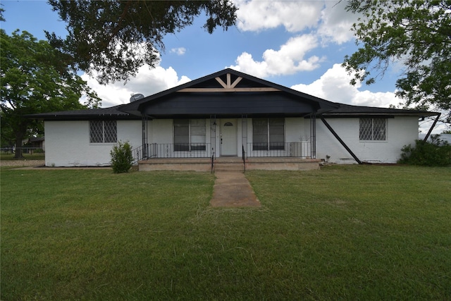 112 Big Bass Rd, West, TX 76691 - view of front of home featuring covered porch, a front lawn, and brick siding