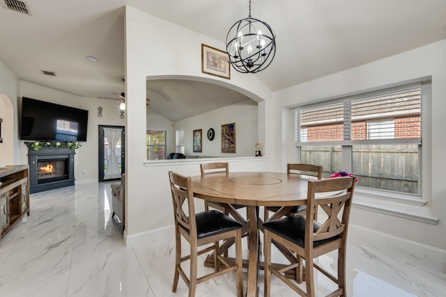 2775 Sweetbriar Ln, Grand Prairie, TX 75052 - dining space with lofted ceiling, light marble finish flooring, arched walkways, a chandelier, and baseboards