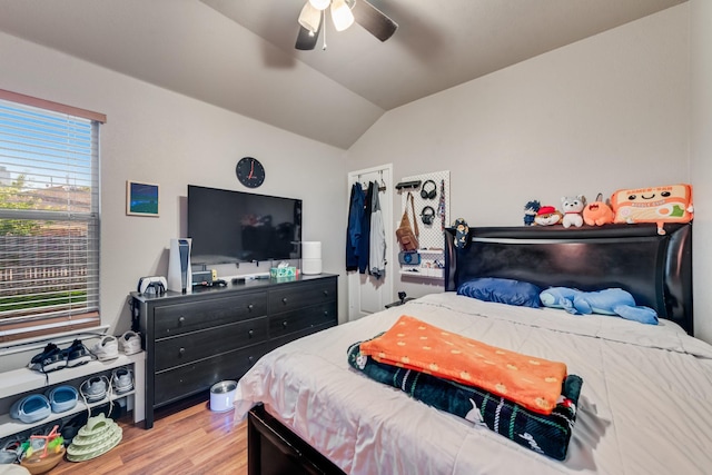 2775 Sweetbriar Ln, Grand Prairie, TX 75052 - bedroom with wood finished floors, lofted ceiling, and a ceiling fan