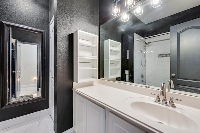 2775 Sweetbriar Ln, Grand Prairie, TX 75052 - full bath with a textured wall, vanity, marble look tile flooring, shower / washtub combination, and baseboards
