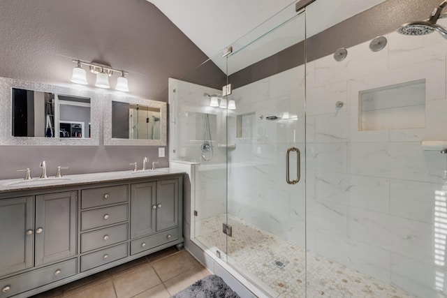 2775 Sweetbriar Ln, Grand Prairie, TX 75052 - full bath featuring vaulted ceiling, a shower stall, tile patterned floors, and double vanity