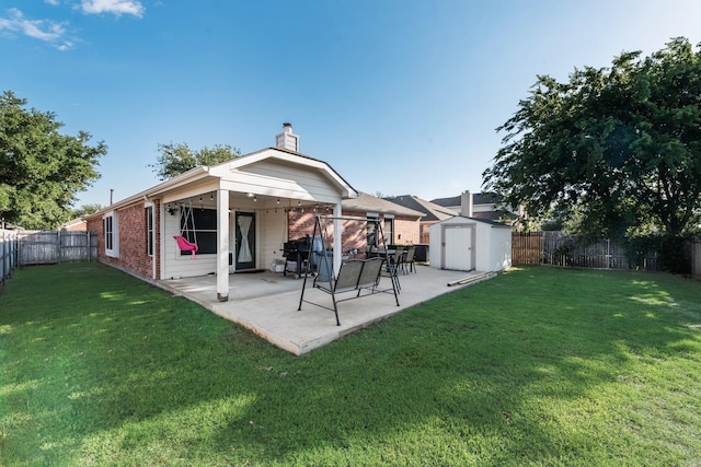 2775 Sweetbriar Ln, Grand Prairie, TX 75052 - back of house featuring brick siding, a storage shed, a chimney, a patio, and an outbuilding