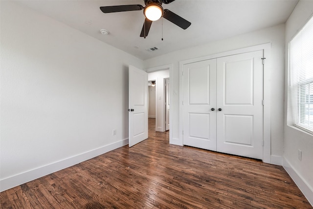 4320 Carmel Ave, Fort Worth, TX 76119 - unfurnished bedroom featuring dark wood finished floors, baseboards, a closet, and ceiling fan