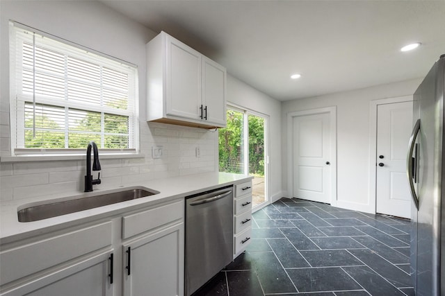 4320 Carmel Ave, Fort Worth, TX 76119 - kitchen with appliances with stainless steel finishes, a sink, plenty of natural light, tasteful backsplash, and recessed lighting
