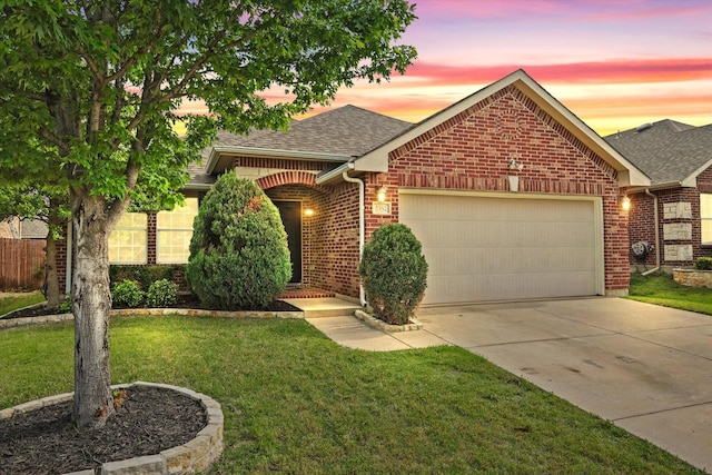 2352 Clairborne Dr, Fort Worth, TX 76177 - view of front of home with a garage, a shingled roof, brick siding, driveway, and a front yard