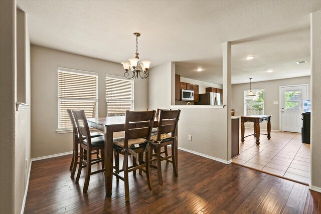 2352 Clairborne Dr, Fort Worth, TX 76177 - dining room with dark wood-style floors, baseboards, a chandelier, and recessed lighting