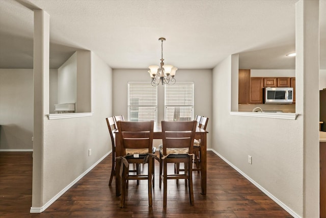 2352 Clairborne Dr, Fort Worth, TX 76177 - dining space with a chandelier, dark wood-style flooring, and baseboards