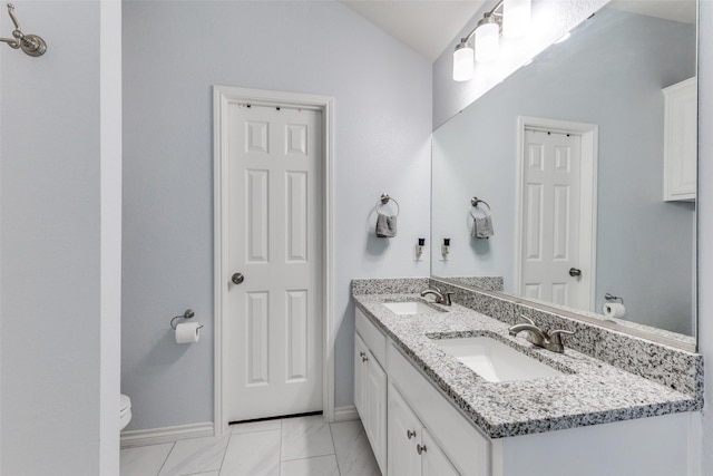 14320 Polo Ranch St, Fort Worth, TX 76052 - bathroom with toilet, baseboards, double vanity, lofted ceiling, and marble finish floors