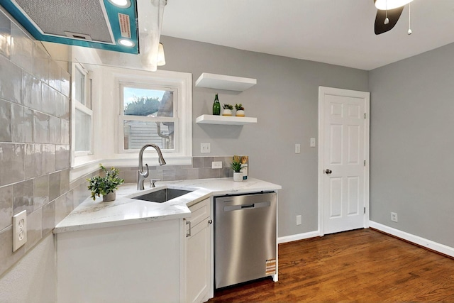 6042 Belgrade Ave, Dallas, TX 75227 - kitchen with stainless steel dishwasher, a sink, white cabinetry, light stone countertops, and dark wood-style floors