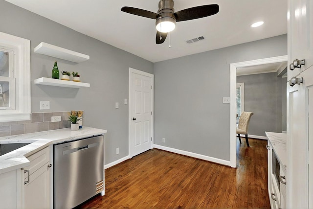 6042 Belgrade Ave, Dallas, TX 75227 - kitchen with stainless steel dishwasher, white cabinetry, light stone countertops, a ceiling fan, and recessed lighting