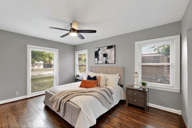 6042 Belgrade Ave, Dallas, TX 75227 - bedroom with baseboards, dark wood-style flooring, and ceiling fan