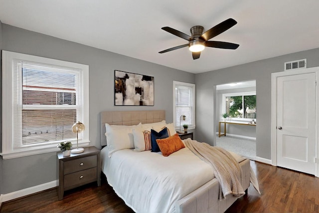 6042 Belgrade Ave, Dallas, TX 75227 - bedroom featuring baseboards, dark wood finished floors, and a ceiling fan