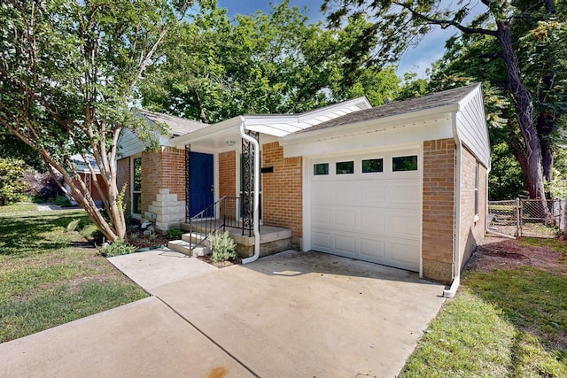 6042 Belgrade Ave, Dallas, TX 75227 - ranch-style house with driveway, brick siding, and a garage