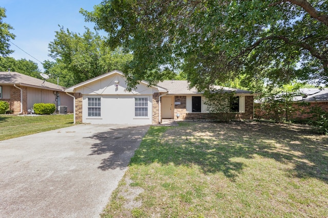 1530 Lime Leaf Ln, Duncanville, TX 75137 - ranch-style house featuring concrete driveway, a front yard, and central AC