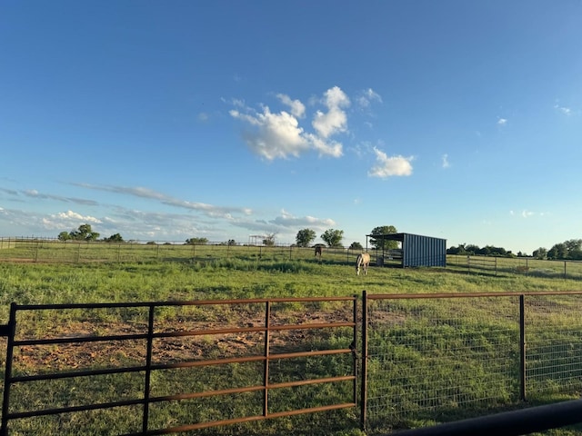 1668 Poe Prairie Rd, Millsap, TX 76066 - view of yard featuring a view of countryside, an outbuilding, and an exterior structure