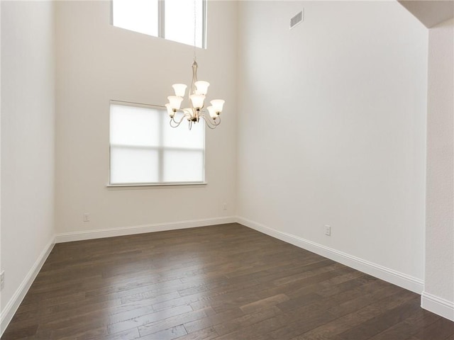 4158 Kate Dr, Frisco, TX 75034 - unfurnished room featuring a chandelier, dark wood-style flooring, and baseboards
