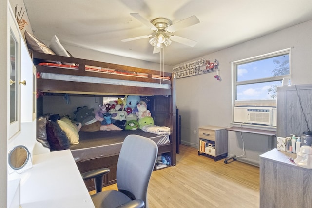 12015 Galva Dr, Dallas, TX 75243 - bedroom featuring cooling unit, light wood finished floors, and ceiling fan