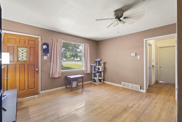 12015 Galva Dr, Dallas, TX 75243 - entryway featuring ceiling fan, light wood-type flooring, and baseboards