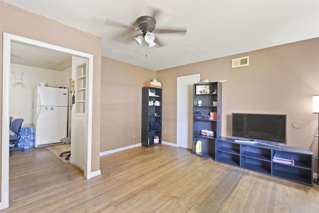 12015 Galva Dr, Dallas, TX 75243 - unfurnished living room with ceiling fan, wood finished floors, and baseboards