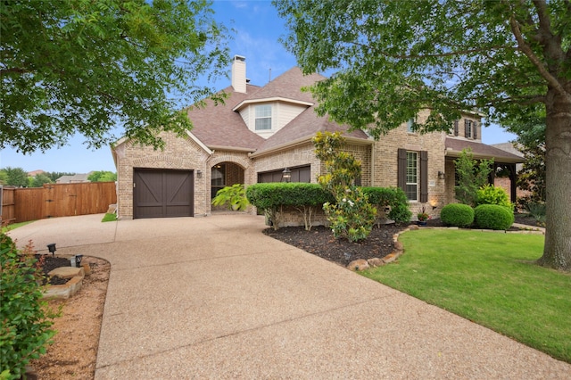 801 Shadow Hill Dr, Prosper, TX 75078 - traditional-style home with brick siding, driveway, an attached garage, and roof with shingles