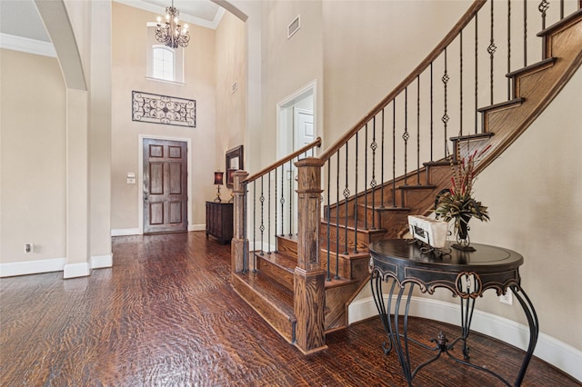 801 Shadow Hill Dr, Prosper, TX 75078 - foyer with arched walkways, ornamental molding, baseboards, a chandelier, and a high ceiling