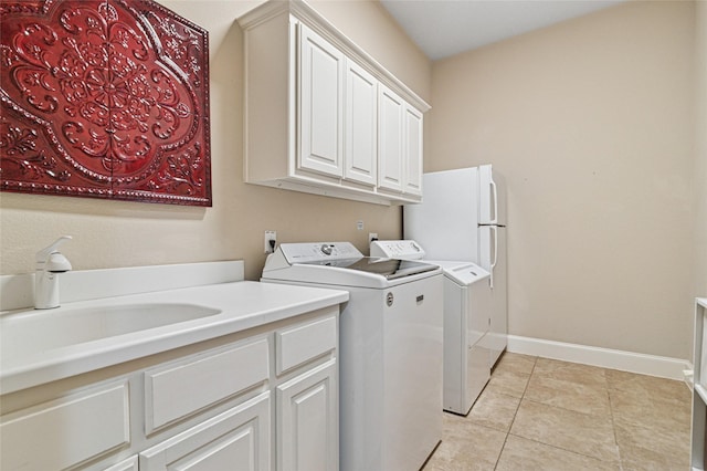 801 Shadow Hill Dr, Prosper, TX 75078 - washroom featuring independent washer and dryer, a sink, light tile patterned flooring, and baseboards
