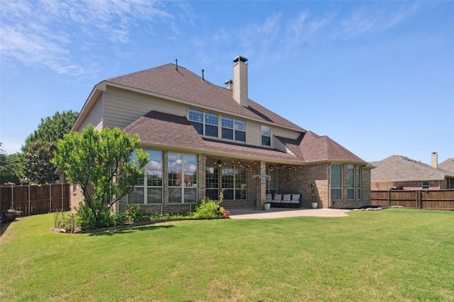 801 Shadow Hill Dr, Prosper, TX 75078 - rear view of house with a patio, a chimney, brick siding, and roof with shingles