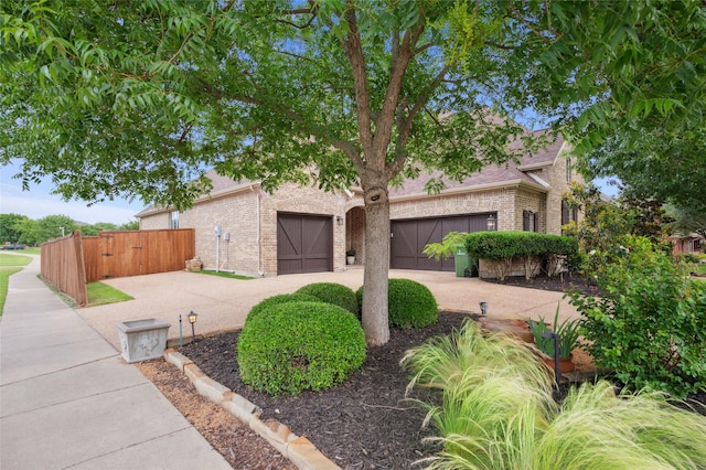 801 Shadow Hill Dr, Prosper, TX 75078 - view of front of house featuring concrete driveway, brick siding, and a garage