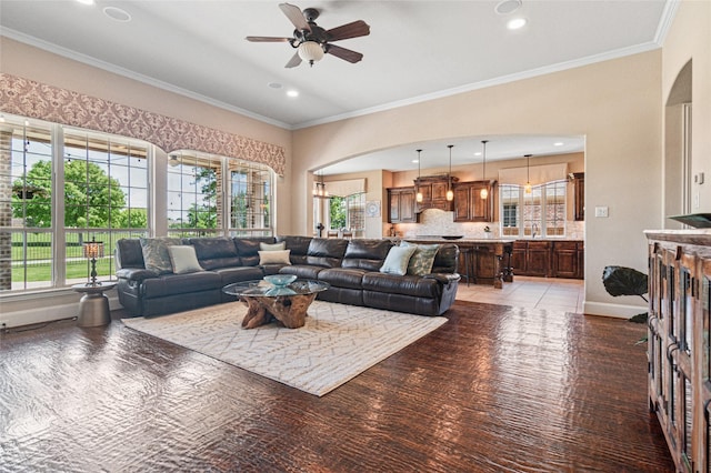 801 Shadow Hill Dr, Prosper, TX 75078 - living room with arched walkways, ceiling fan, healthy amount of natural light, crown molding, and recessed lighting