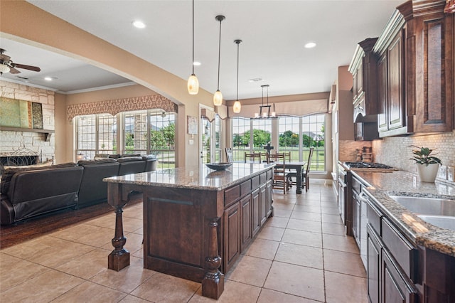 801 Shadow Hill Dr, Prosper, TX 75078 - kitchen with open floor plan, ceiling fan, dark brown cabinets, backsplash, and recessed lighting