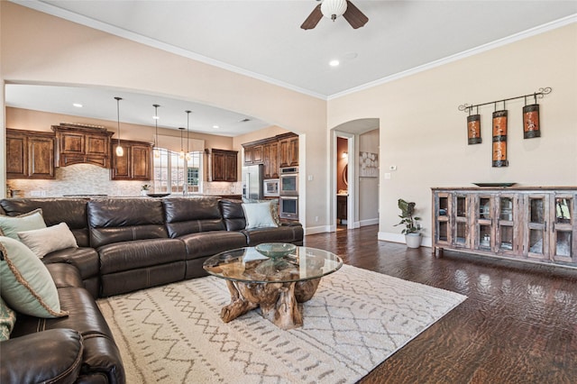 801 Shadow Hill Dr, Prosper, TX 75078 - living area featuring ceiling fan, arched walkways, baseboards, dark wood-style floors, and ornamental molding