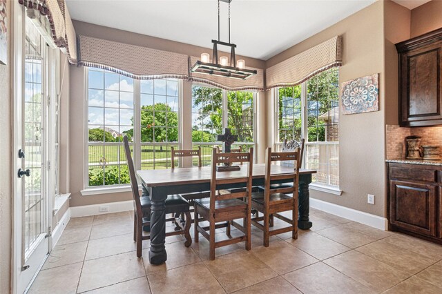 801 Shadow Hill Dr, Prosper, TX 75078 - dining area with healthy amount of natural light, baseboards, and light tile patterned flooring