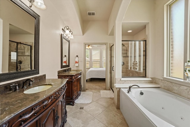 416 Fairway Bluff Dr, Wylie, TX 75098 - bathroom with a stall shower, a tub with jets, two vanities, tile patterned flooring, and ensuite bathroom