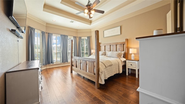 12046 Erin Ln, Fort Worth, TX 76179 - bedroom with crown molding, dark wood-style floors, a tray ceiling, and a ceiling fan