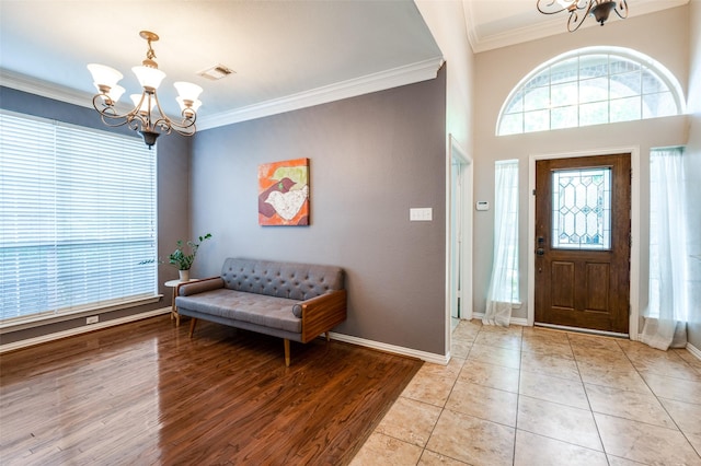 1414 Tulane Ct, Allen, TX 75013 - foyer entrance with a chandelier, crown molding, baseboards, and light wood-style flooring