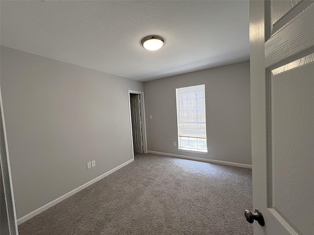902 Mack Pl, Denton, TX 76209 - empty room with carpet and baseboards