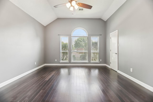 11003 Canoe Rd, Frisco, TX 75035 - spare room featuring a ceiling fan, baseboards, dark wood-style floors, and vaulted ceiling