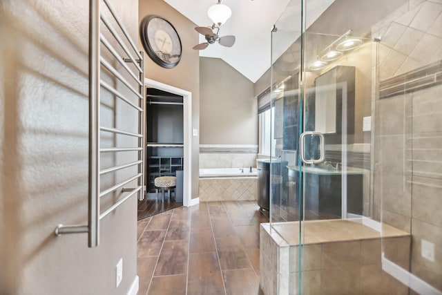 11003 Canoe Rd, Frisco, TX 75035 - full bath featuring vaulted ceiling, ceiling fan, a garden tub, and a shower stall