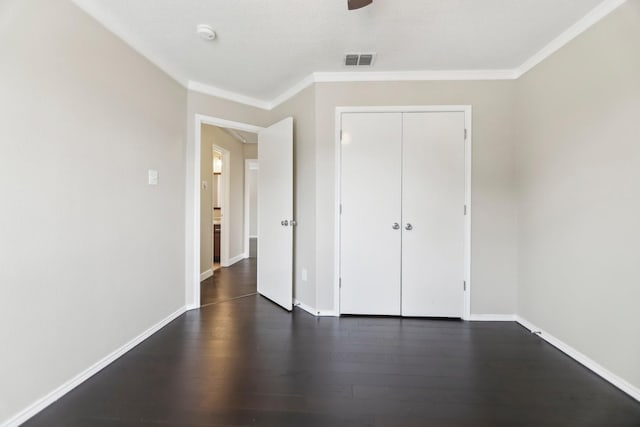11003 Canoe Rd, Frisco, TX 75035 - unfurnished bedroom featuring dark wood-type flooring, crown molding, baseboards, a closet, and a ceiling fan