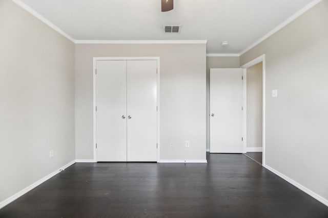 11003 Canoe Rd, Frisco, TX 75035 - unfurnished bedroom featuring ornamental molding, dark wood finished floors, baseboards, a closet, and ceiling fan